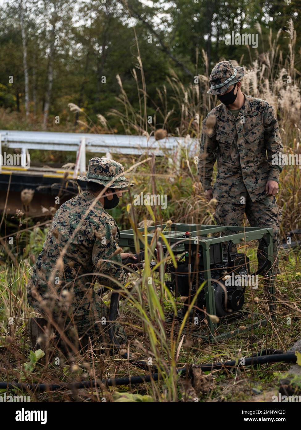 U.S. Marine Corps Cpl. Steven Taylor, left, and Cpl. Samuel Ruehle