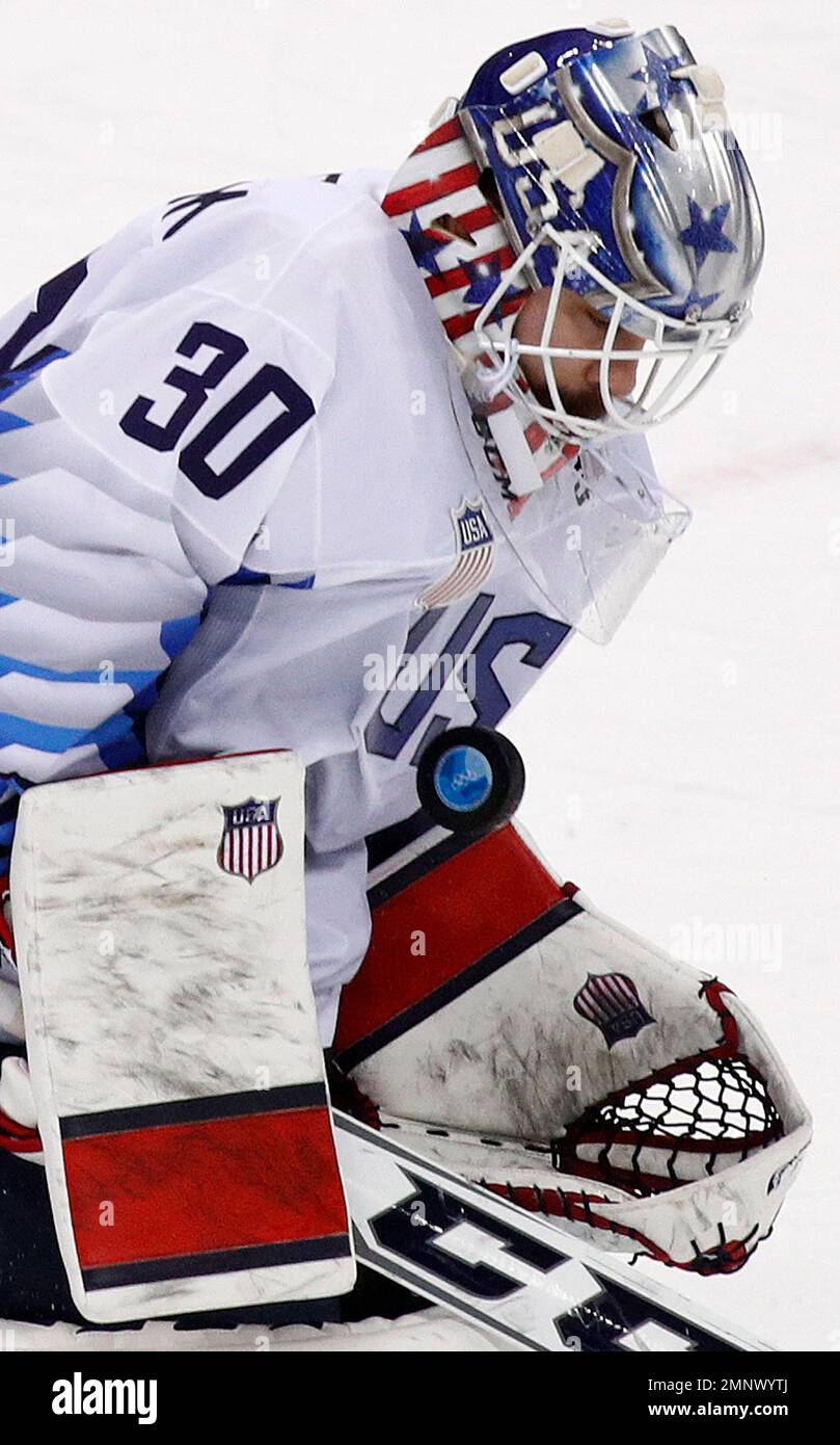 goalie Ryan Zapolski 30 of the United States deflects the puck  