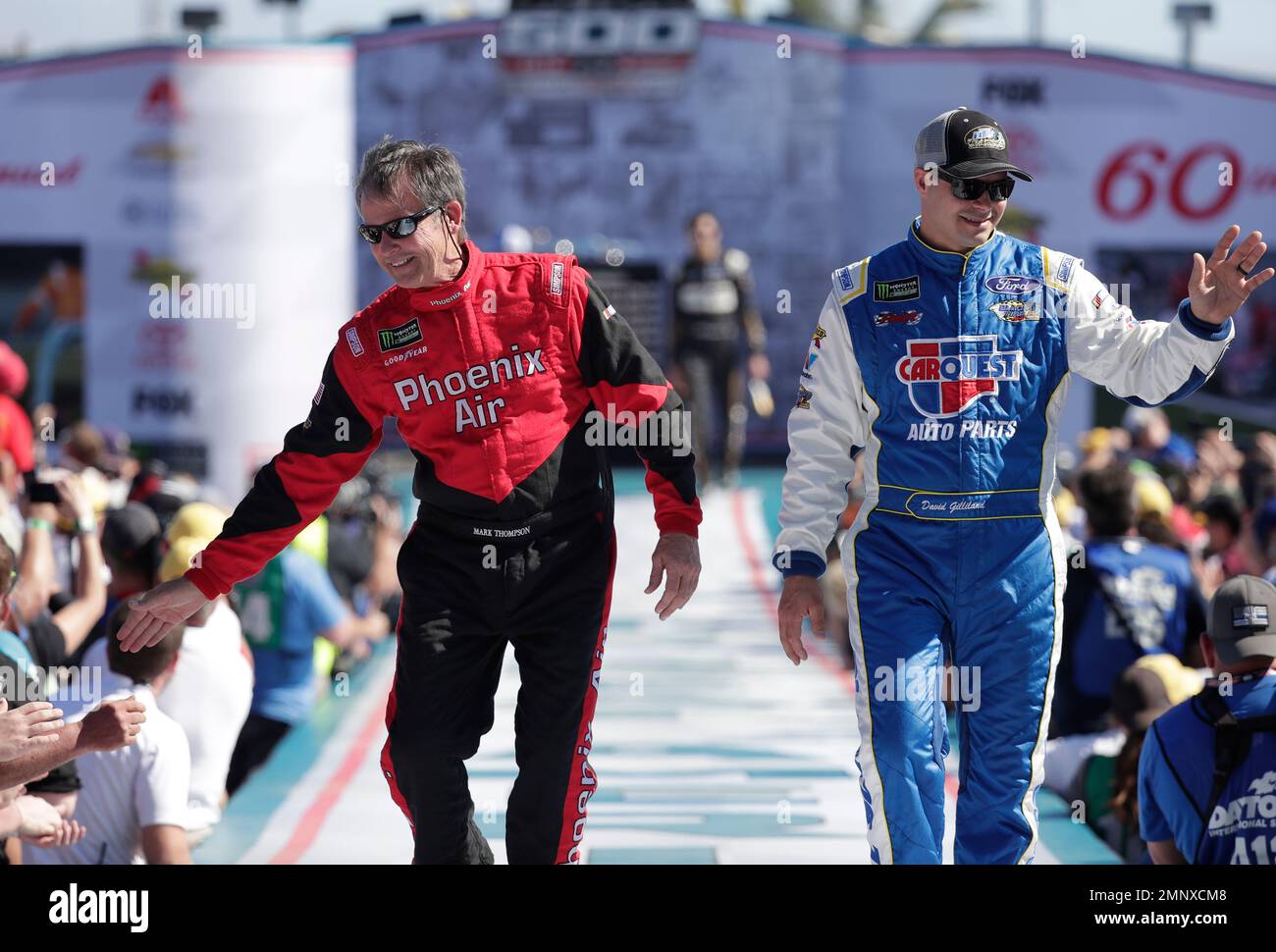 Mark Thompson, left, and David Gilliland greet fans as they are ...
