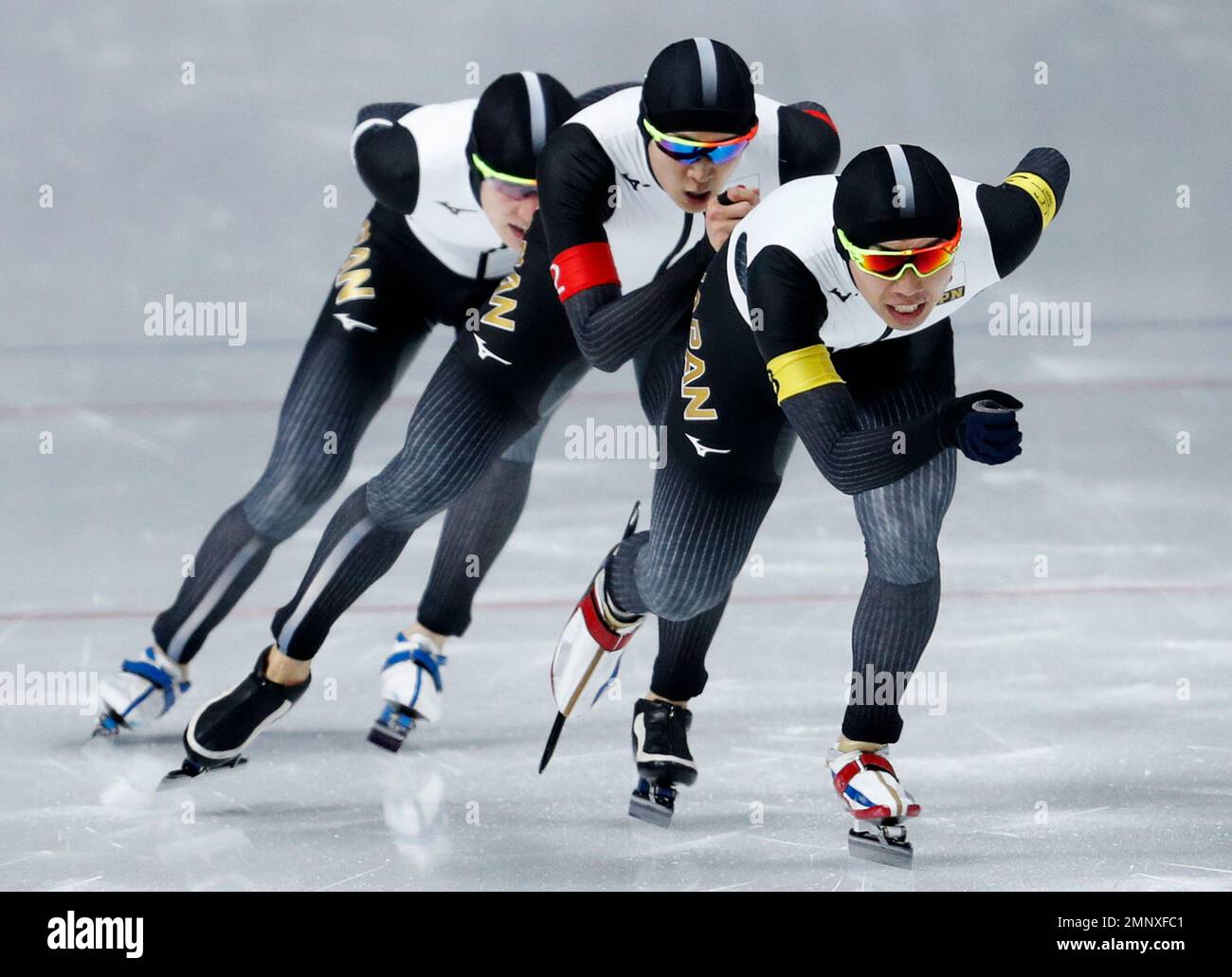 Team Japan with Shane Williamson, rear, Shota Nakamura, center, and Seitaro  Ichinohe, front, competes during the quarterfinals of the men's team  pursuit speedskating race at the Gangneung Oval at the 2018 Winter