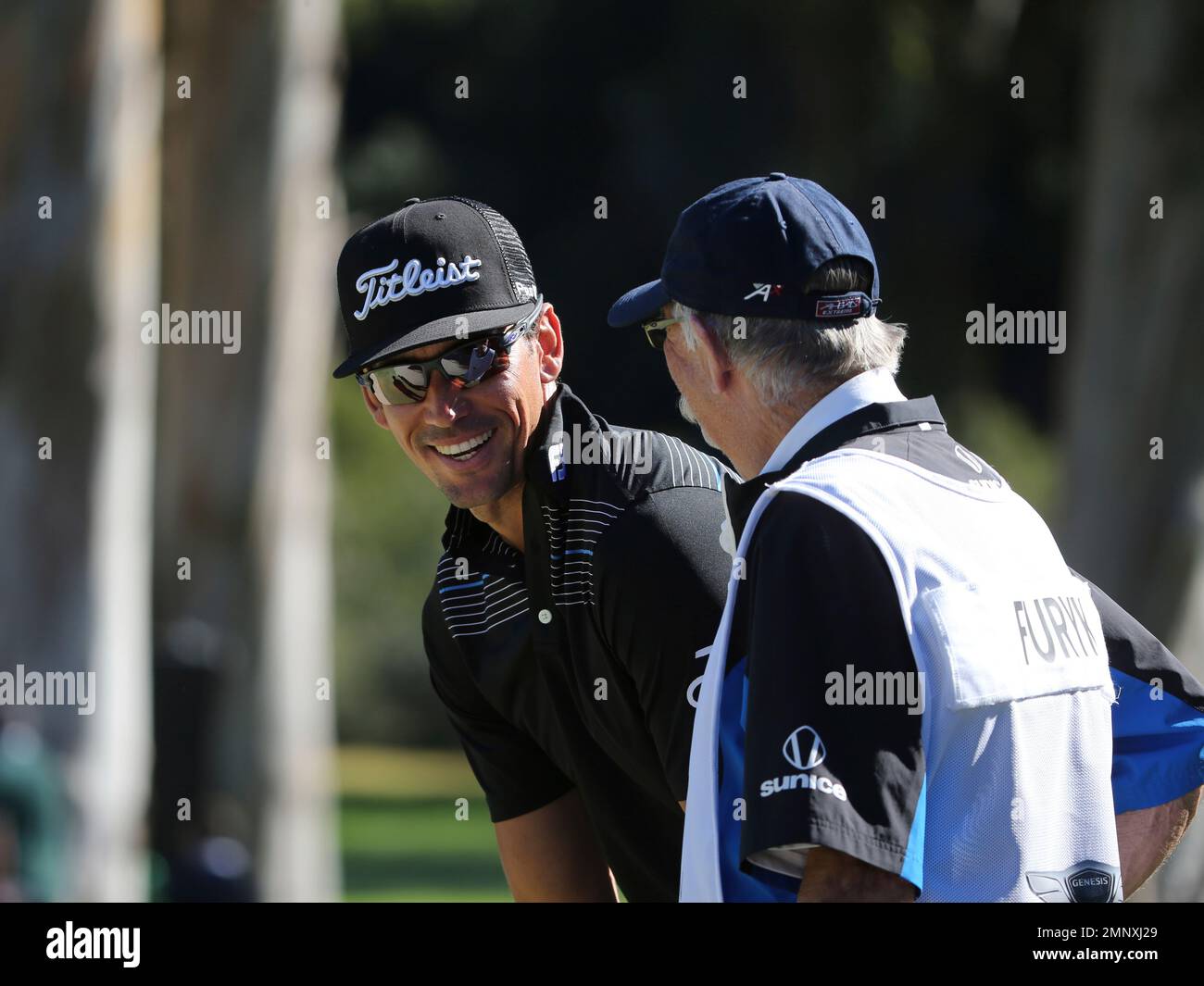 Rafa Cabrera Bello, of Spain, and caddy Fluff Cowan in the second round