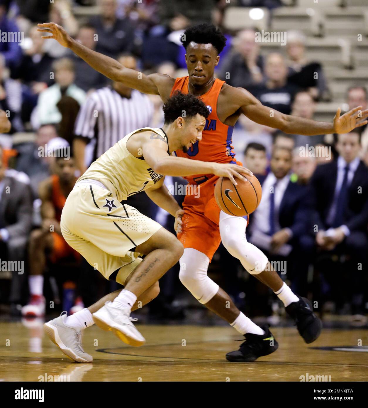 Vanderbilt guard Payton Willis, left, drives against Florida guard Mike