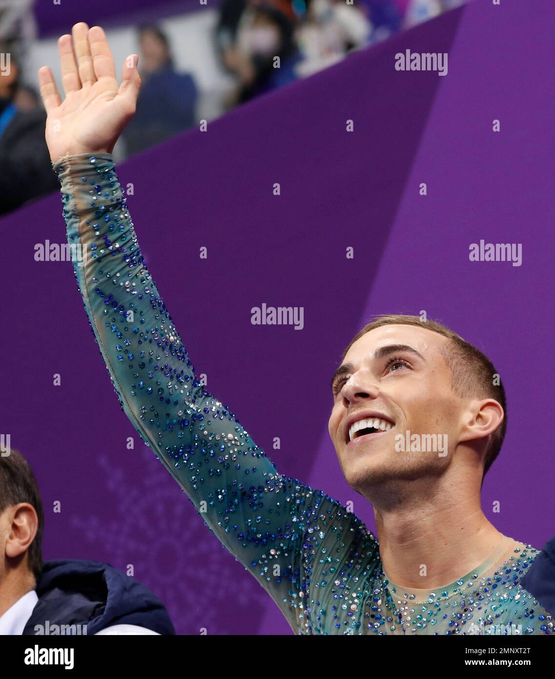 Adam Rippon of the United States reacts as his score is posted