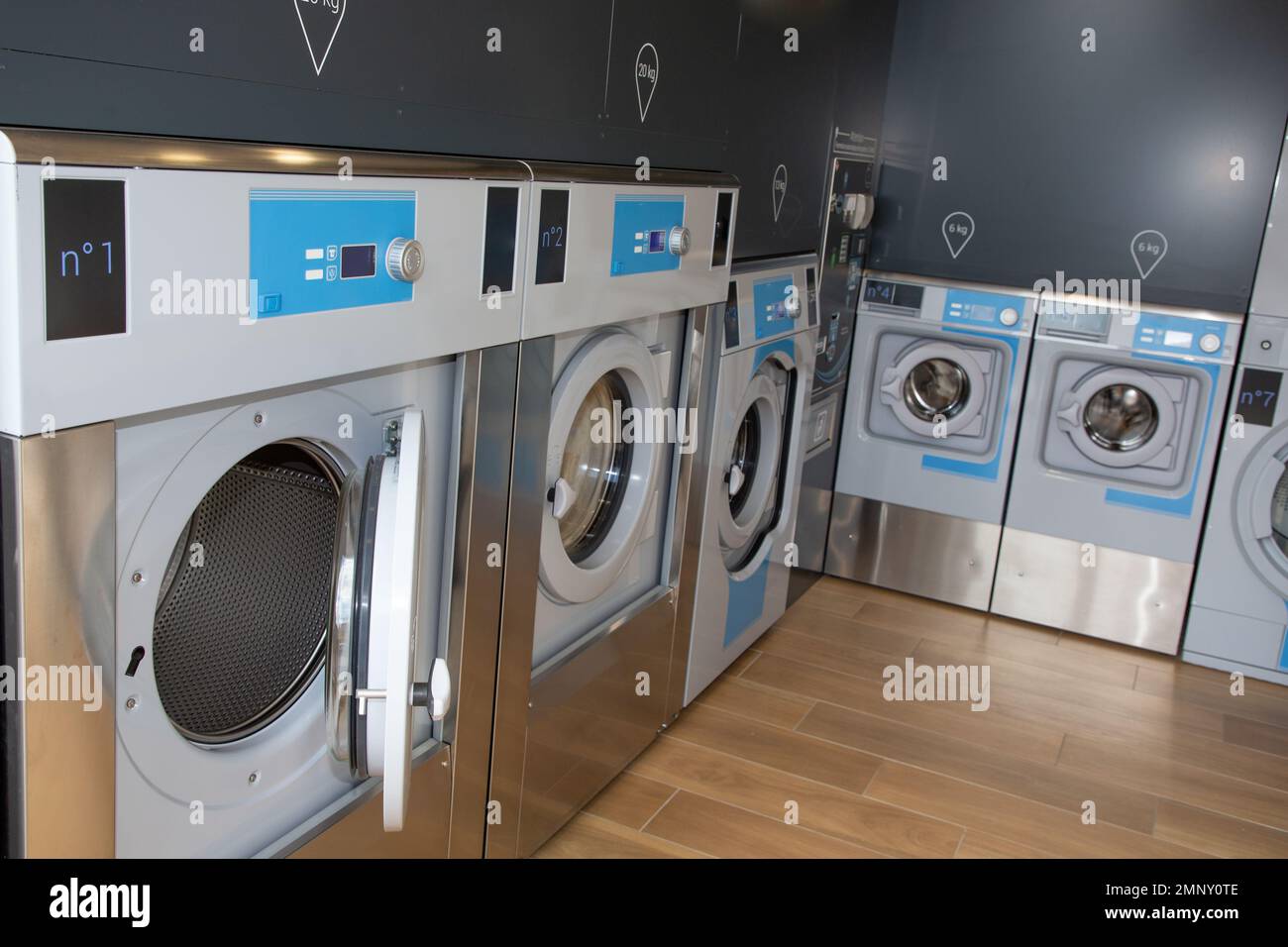 Public laundry with modern laundromat washing machines Stock Photo Alamy