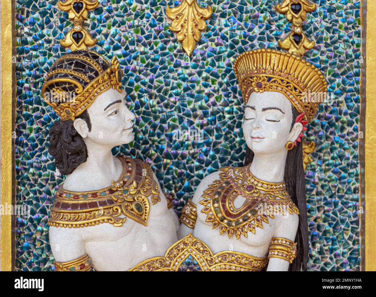 Figurative decoration on the wall of a Buddhist temple Wat Pariwat, Bangkok, Thailand Stock Photo