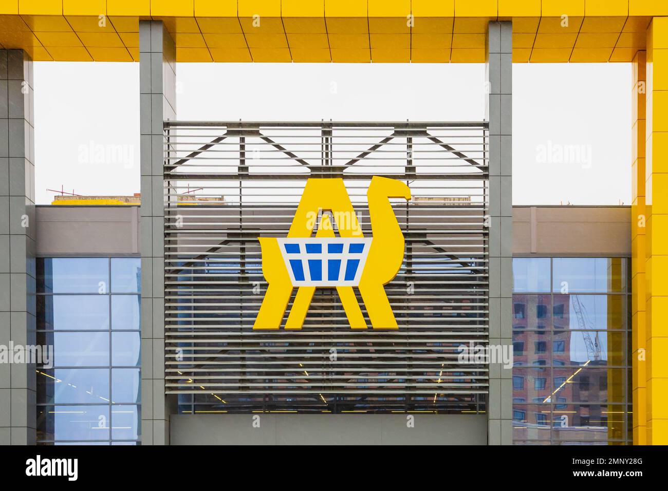 Anwar hypermarket store sign. Yellow camel and blue shopping cart sign ...