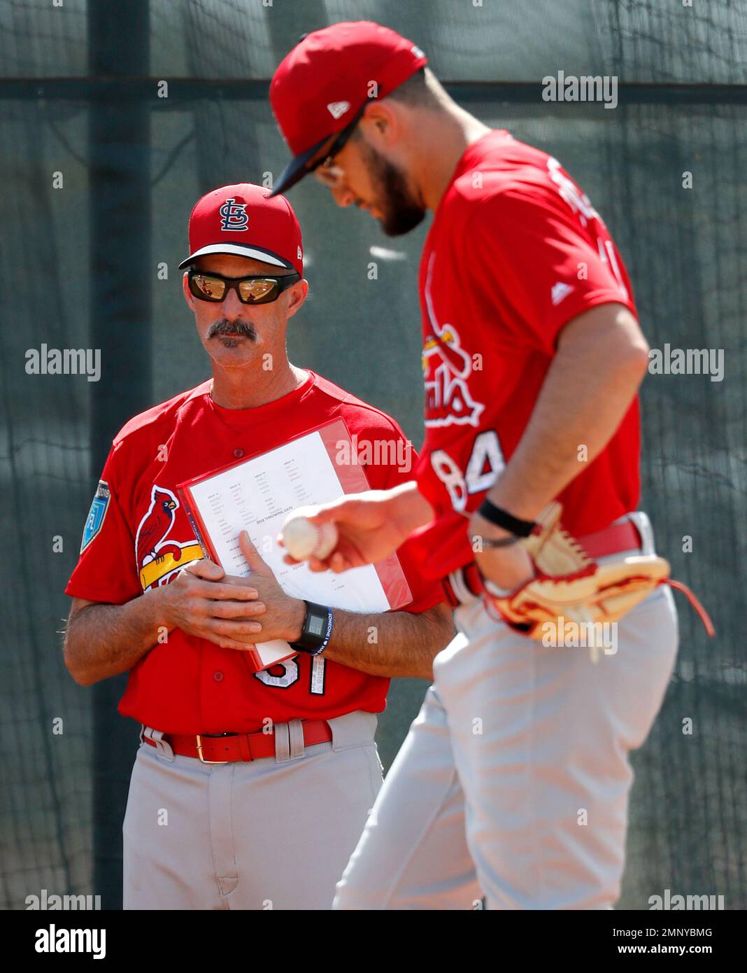 St. Louis Cardinals pitching coach Mike Maddux, left, watches pitcher