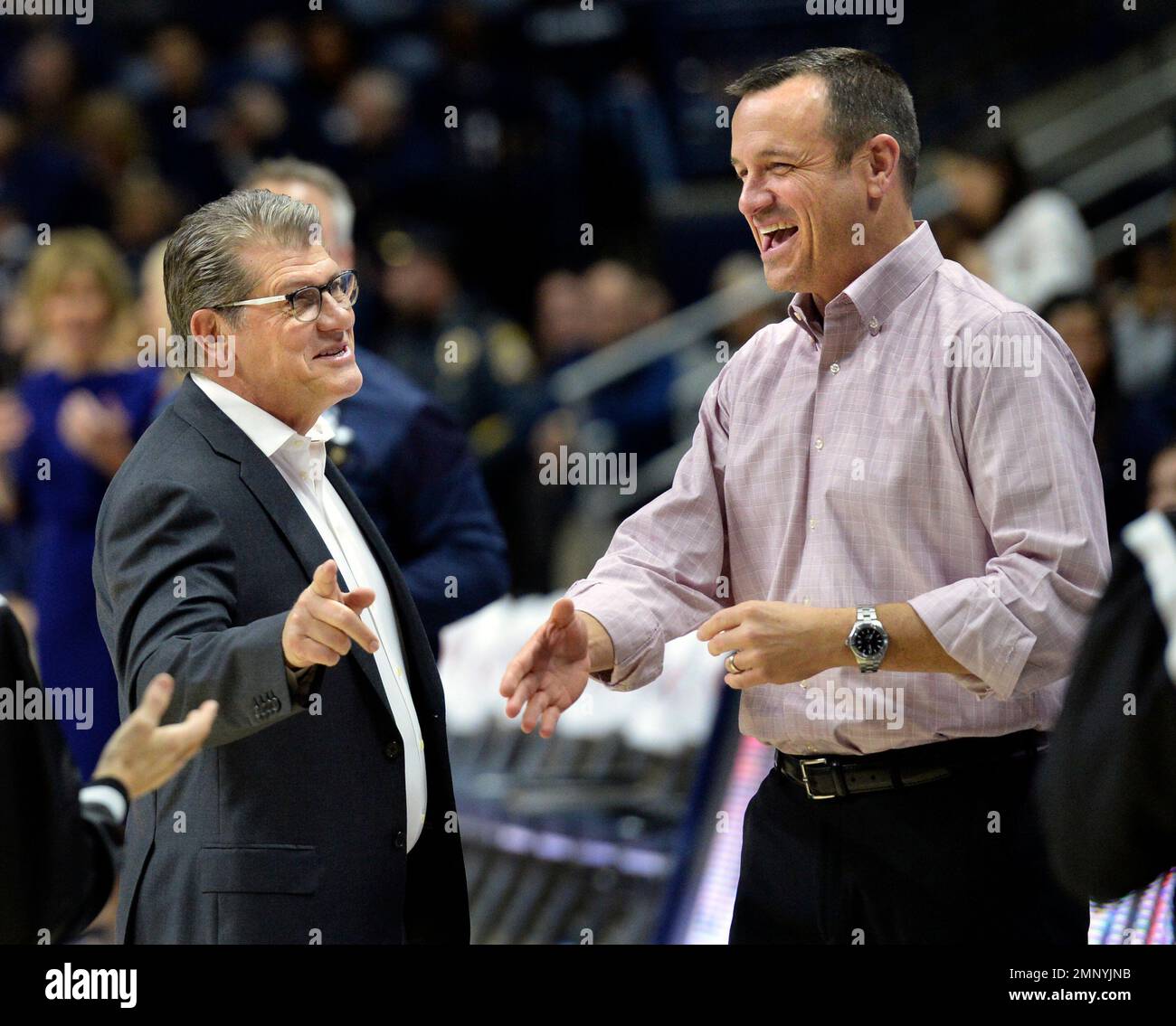 Connecticut head coach Geno Auriemma, left, greets Louisville head ...