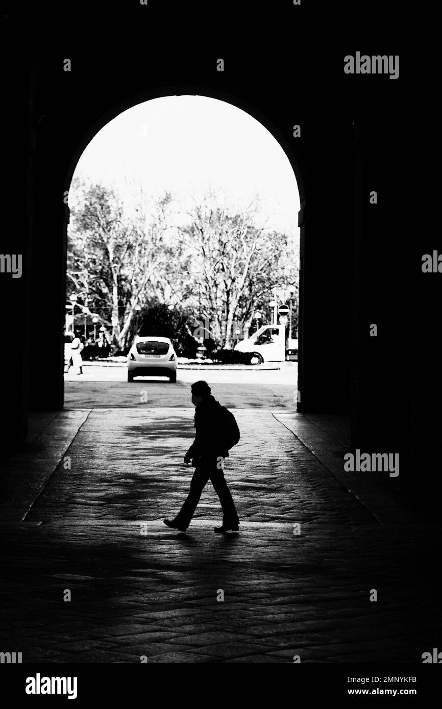 black and white landscape of man under the arcades of the Pilotta Parma Italy Stock Photo