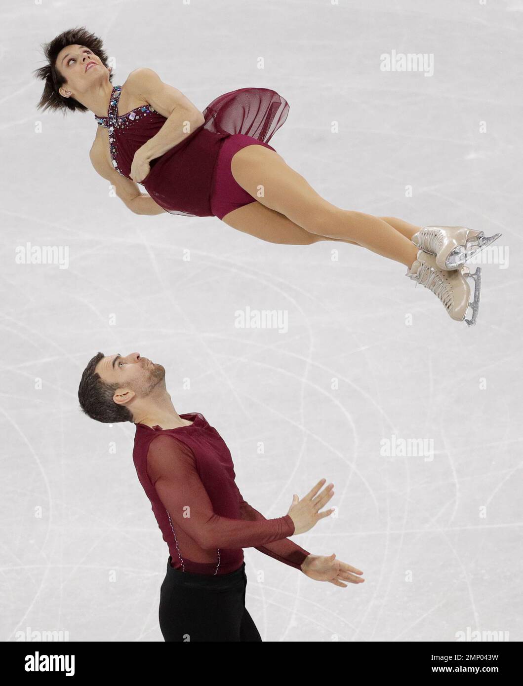 Meagan Duhamel and Eric Radford of Canada perform in the team event