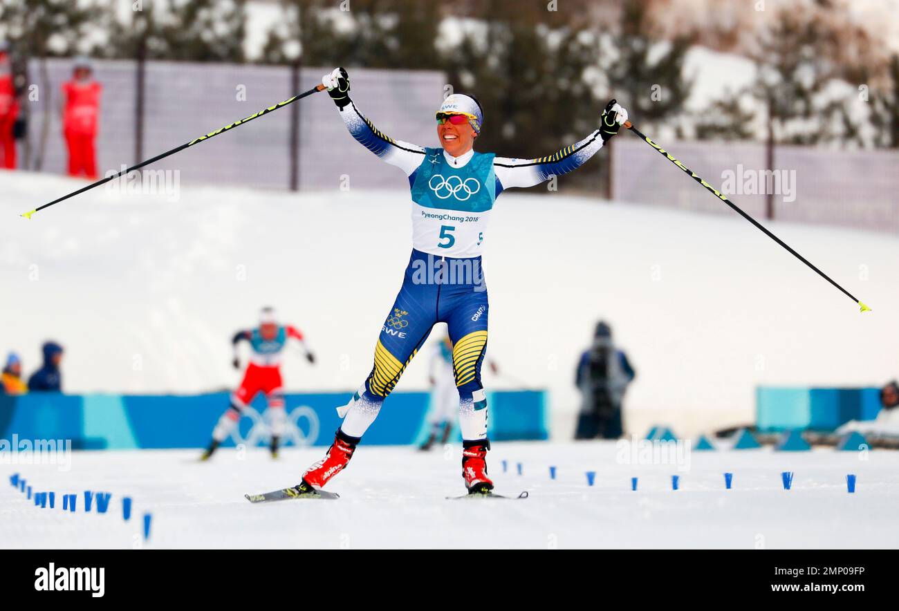 Charlotte Kalla, of Sweden, celebrates after winning the womens 7.5km /7.5km skiathlon cross-country skiing competition at the 2018 Winter Olympics in Pyeongchang, South Korea, Saturday, Feb
