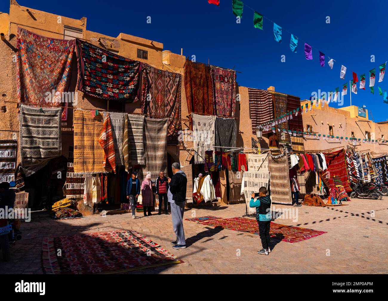 Carpet sellers at market square, North Africa, Ghardaia, Algeria Stock Photo