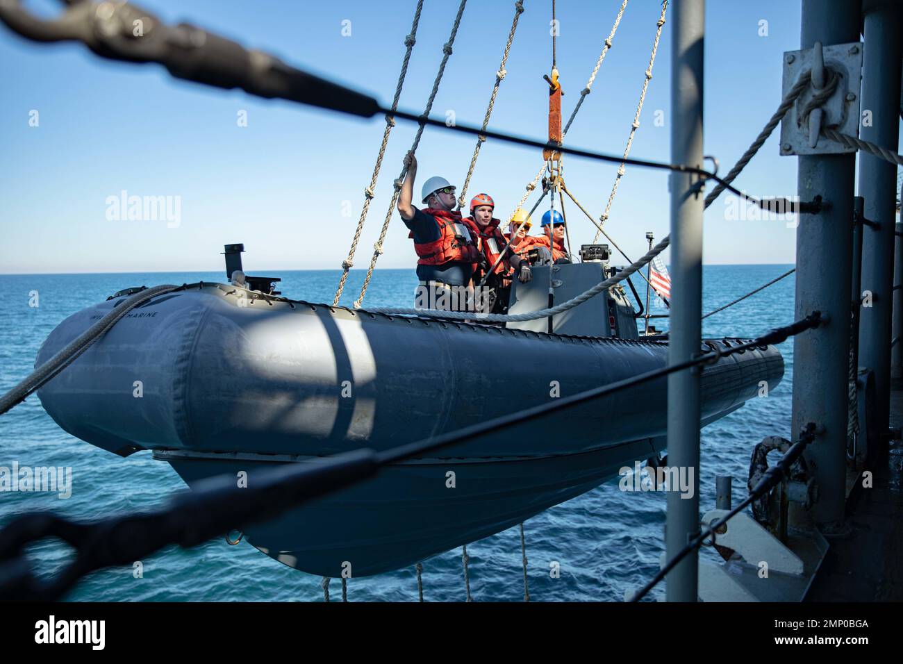 221007NLK6470447 ATLANTIC OCEAN—From left Ens. Zachary Catz