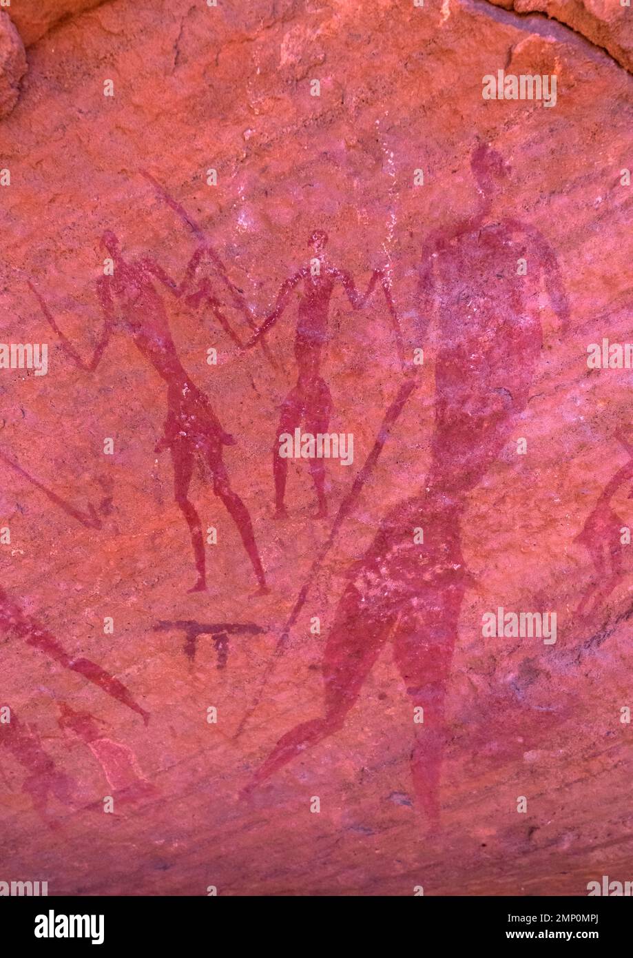 Rock painting depicting men with swords, Tassili N'Ajjer National Park, Tadrart Rouge, Algeria Stock Photo