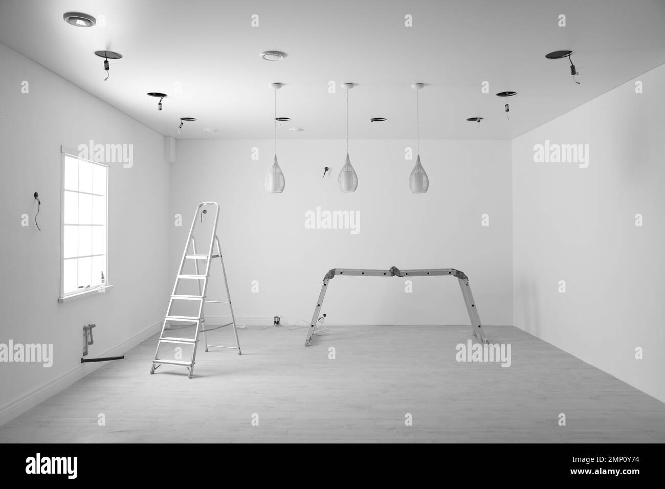 Empty room with stretch ceiling and ladders Stock Photo Alamy