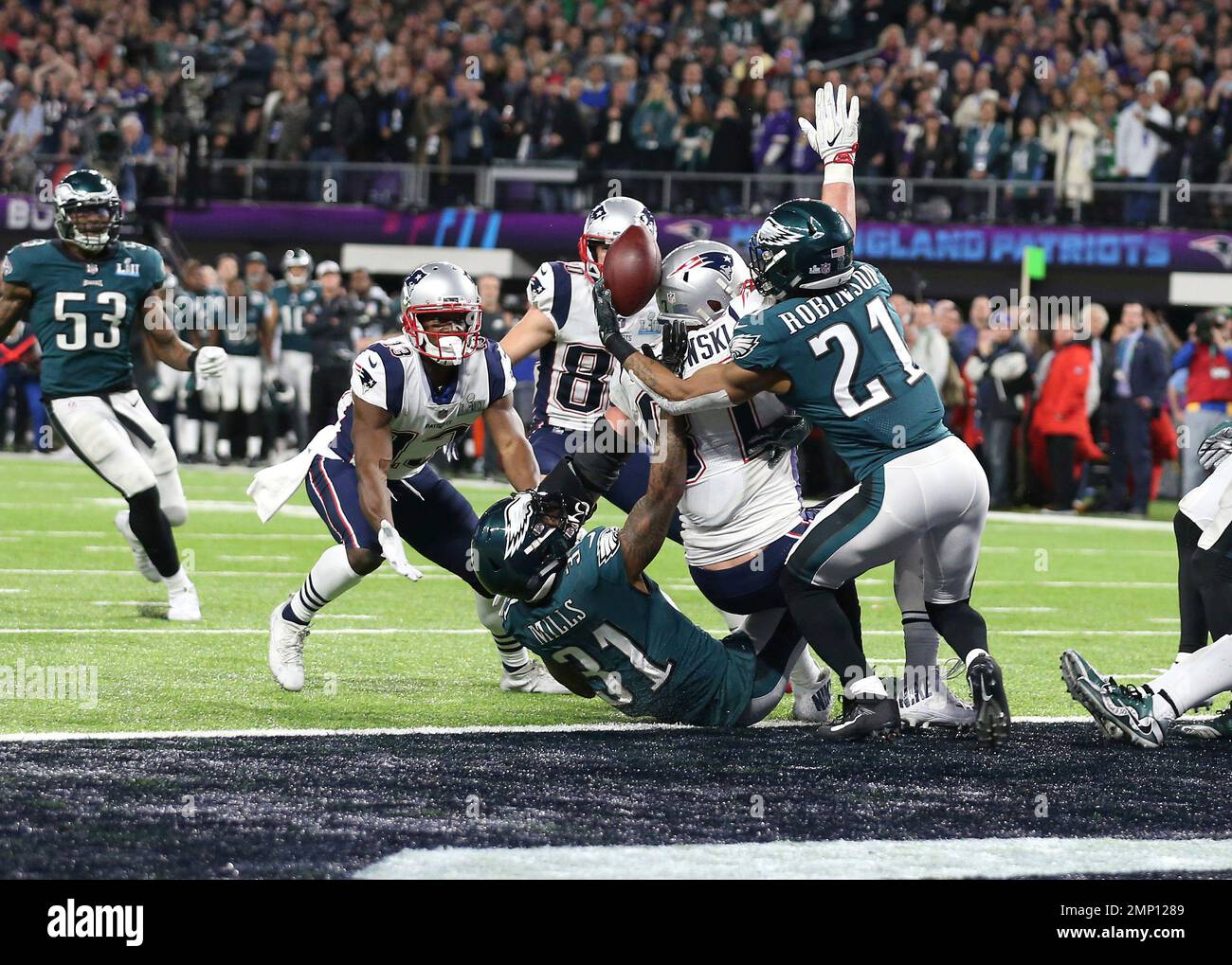 Philadelphia Eagles cornerback Patrick Robinson (21) reaches out to pull in  a pass intended for New England Patriots tight end Rob Gronkowski (87) on  the last play of the game in Super