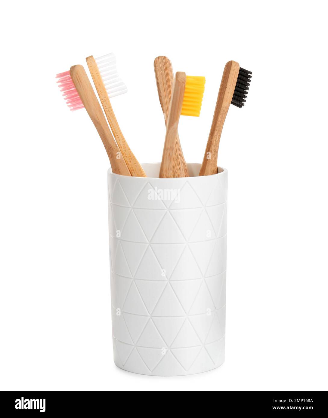 Bamboo toothbrushes in holder isolated on white Stock Photo - Alamy