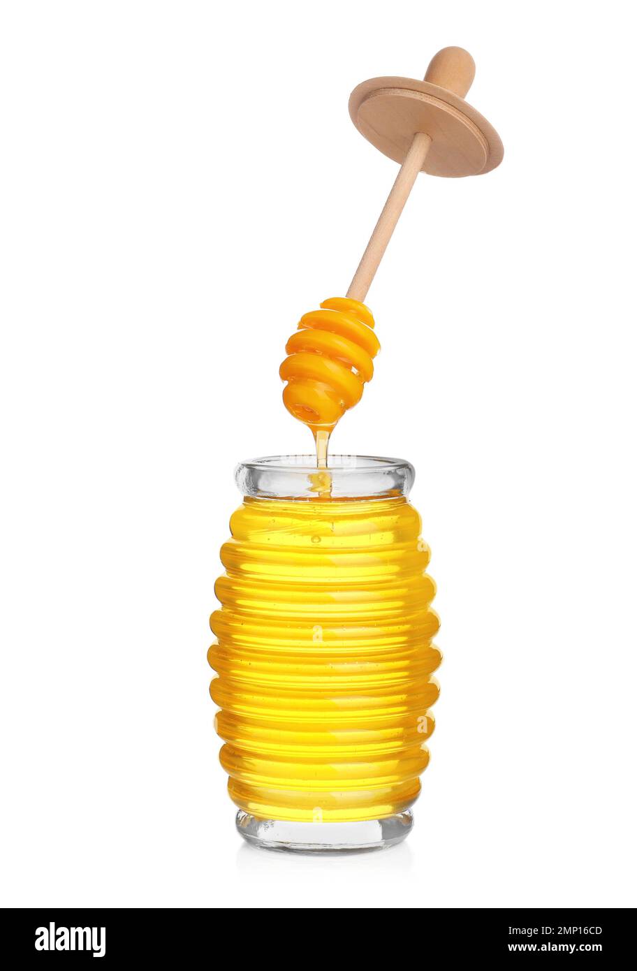 Honey dripping from dipper into jar isolated on white Stock Photo - Alamy
