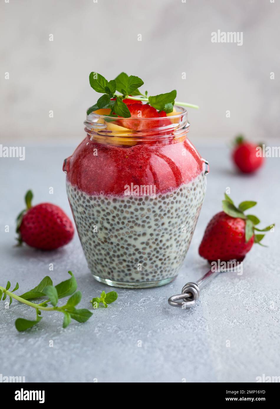 Strawberry and chia seeds pudding in a jar for breakfast Stock Photo