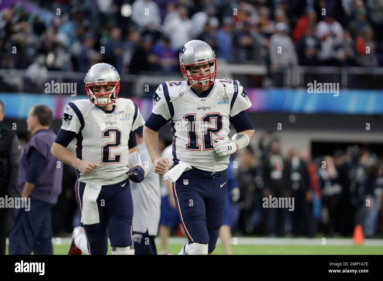New England Patriots' Tom Brady (12) and Brian Hoyer (2) warm up before the  NFL Super