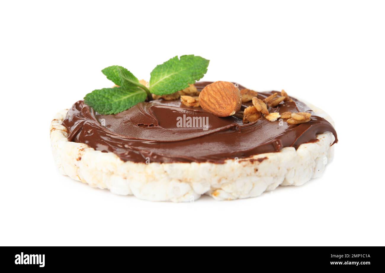 Puffed rice cake with chocolate spread, nuts and mint isolated on white