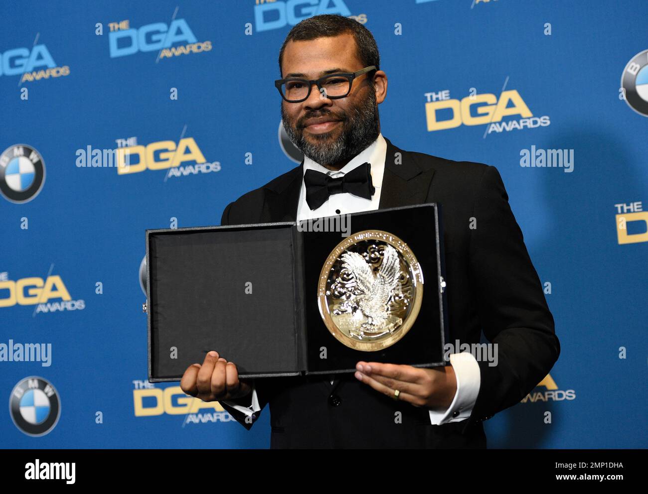 Jordan Peele poses in the press room with a medallion honoring his ...