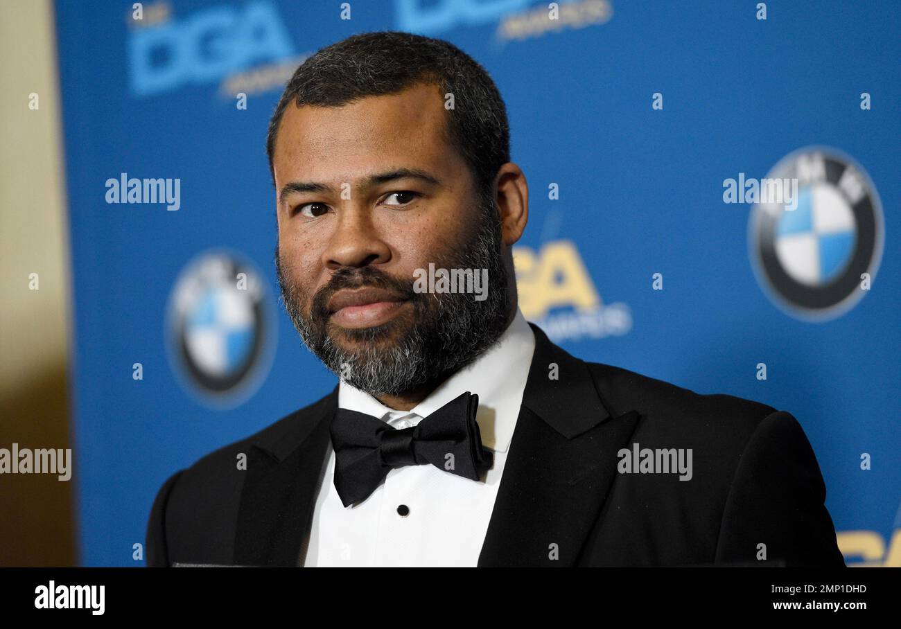 Jordan Peele poses in the press room with a medallion honoring his ...