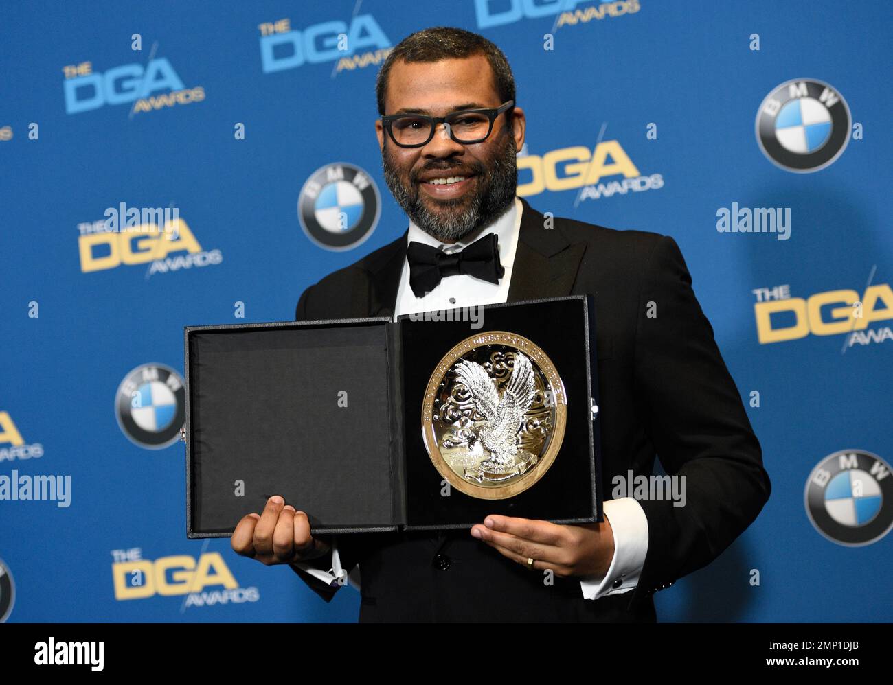 Jordan Peele poses in the press room with a medallion honoring his ...