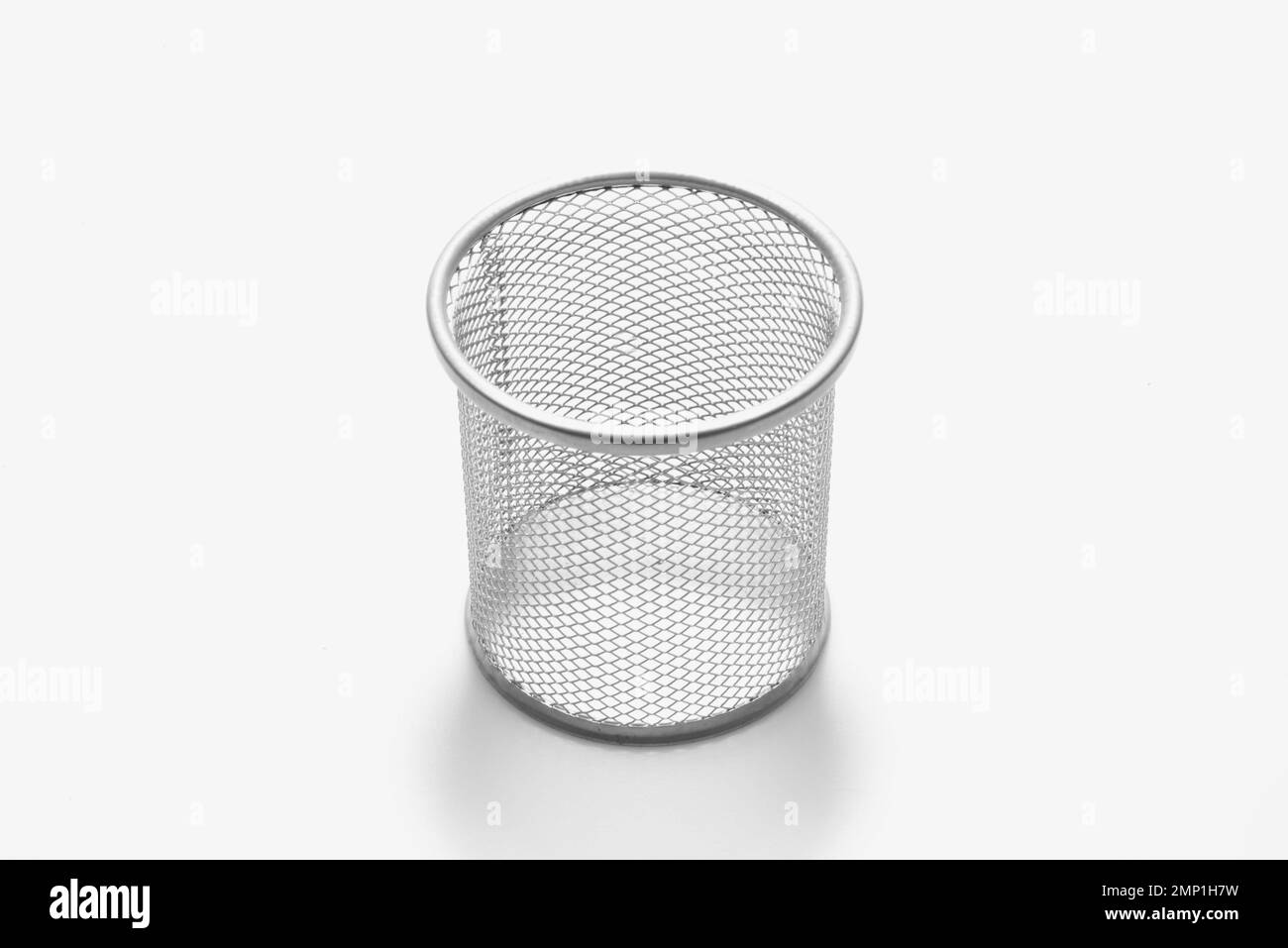 Empty metal trashcan, garbage bin in silver color isolated on white background Stock Photo
