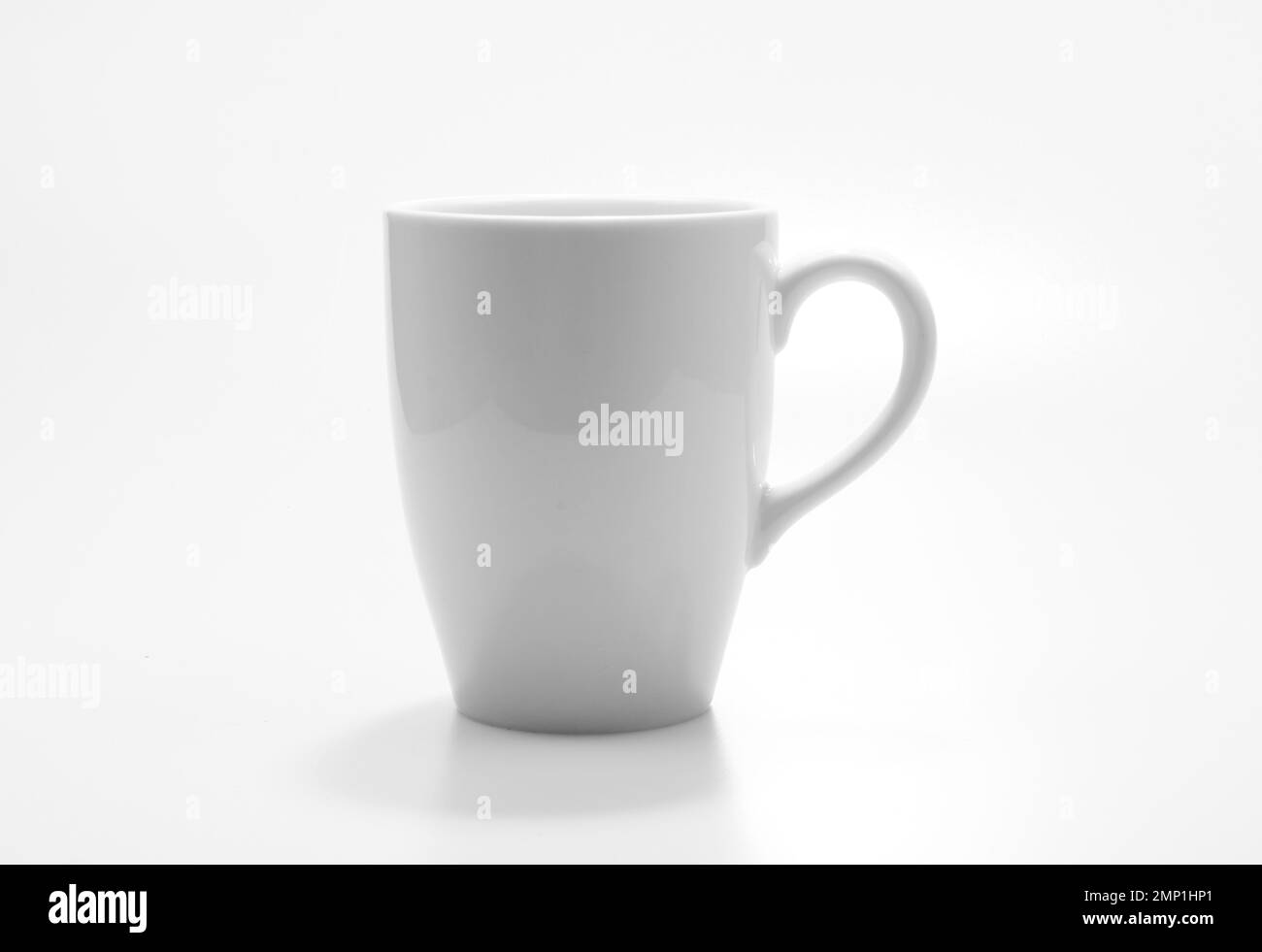 White mug empty blank for coffee or tea isolated on white background, close-up Stock Photo