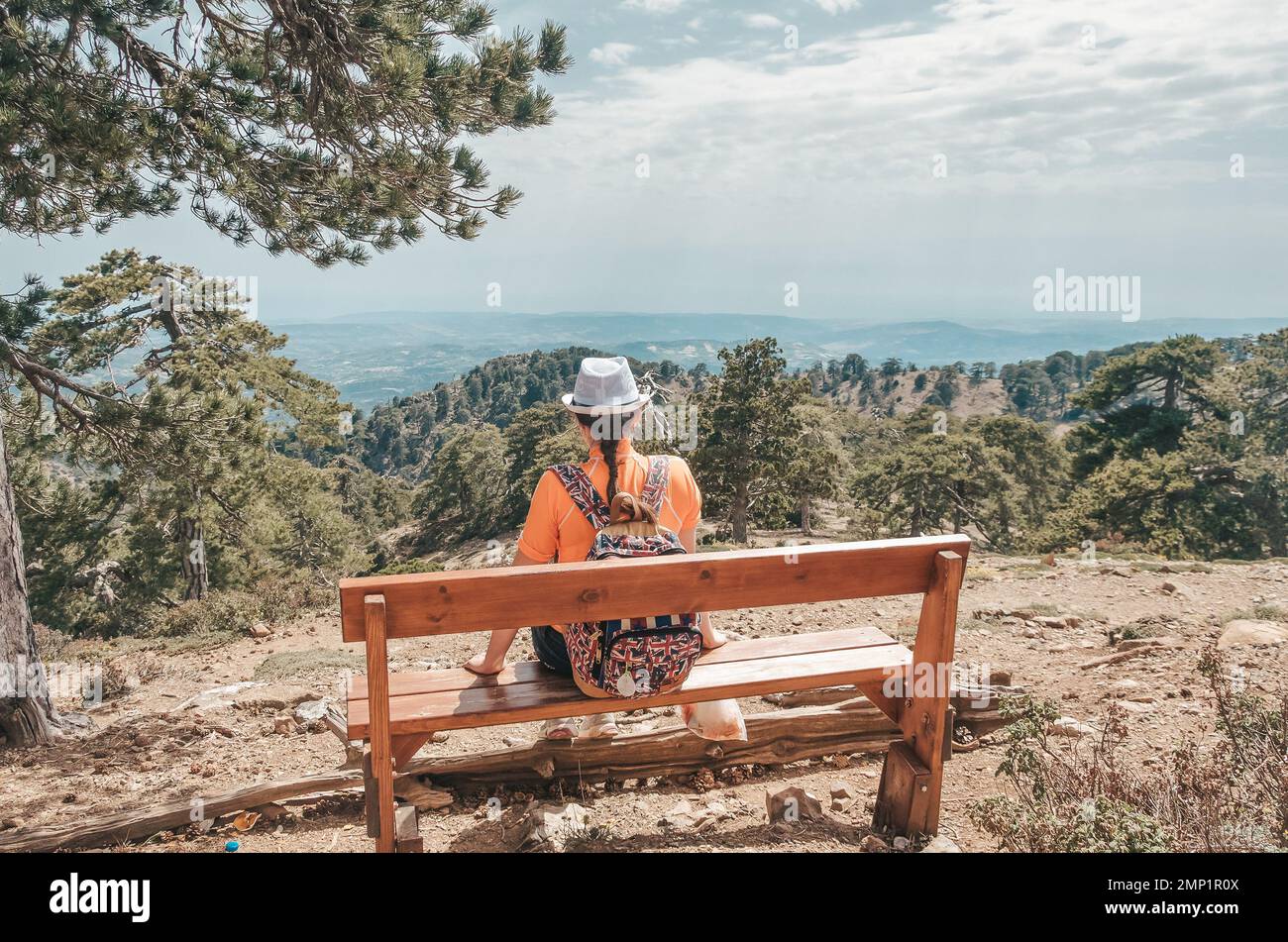 Girl sitting on the bench in Troodos mountain, Cyprus Stock Photo - Alamy