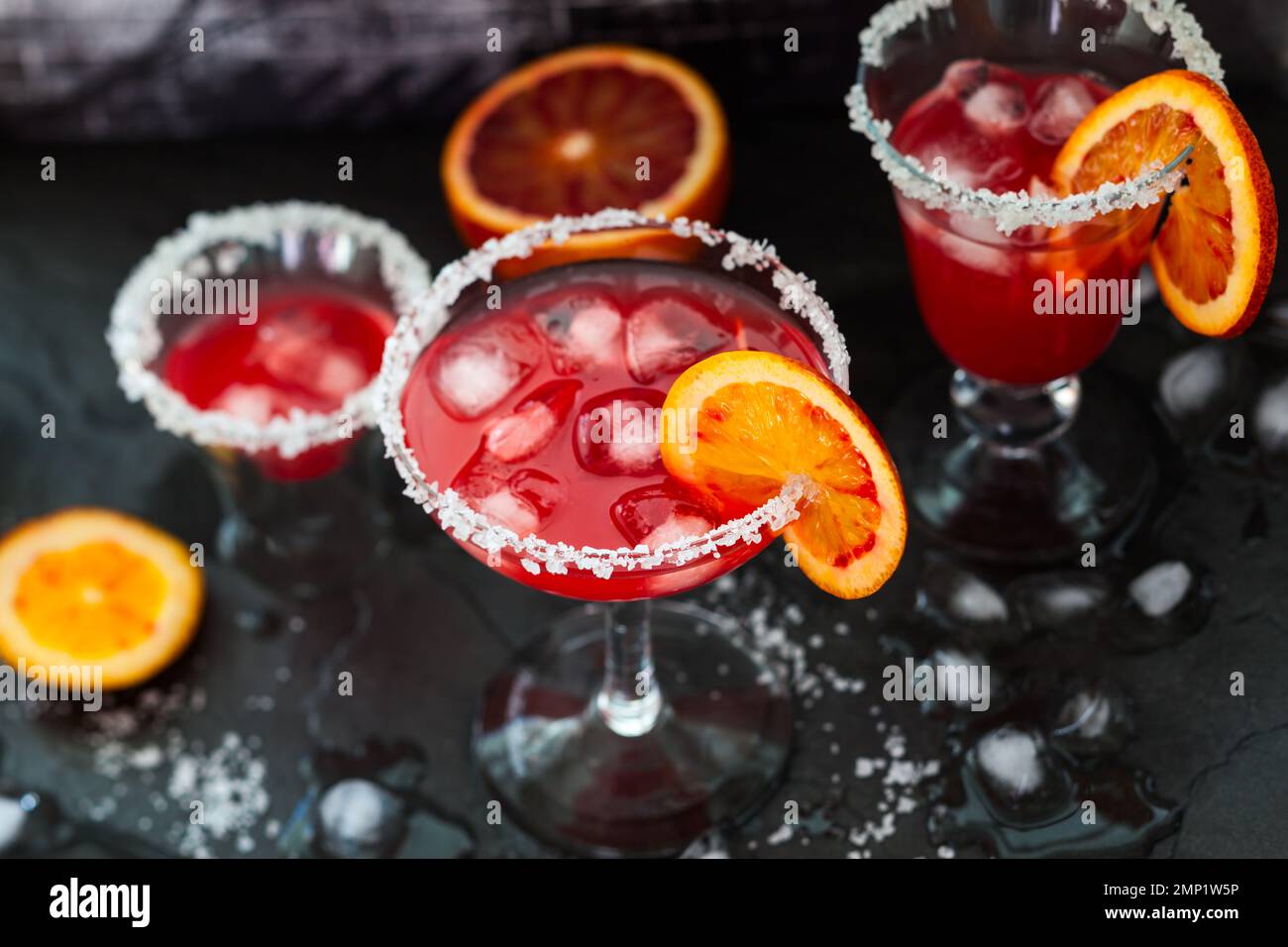 Blood Orange Margarita in glass with salted rim Stock Photo