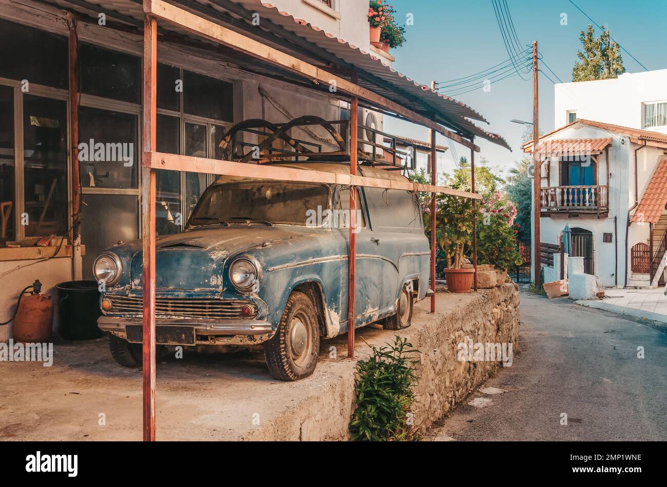 Polis ancient street. Old taverns and a retro car in a Mediterranean