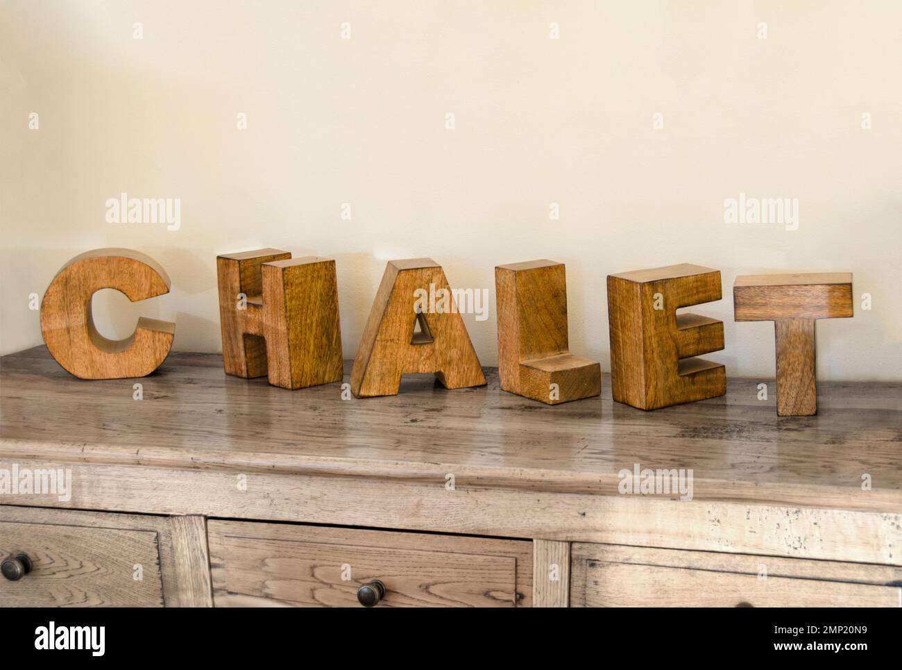 wooden cubes forming the word Chalet,placed on a furniture and used for
