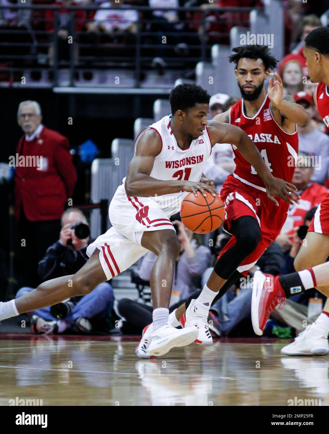 Wisconsin's Khalil Iverson (21) and Nebraska's Isaac Copeland (14