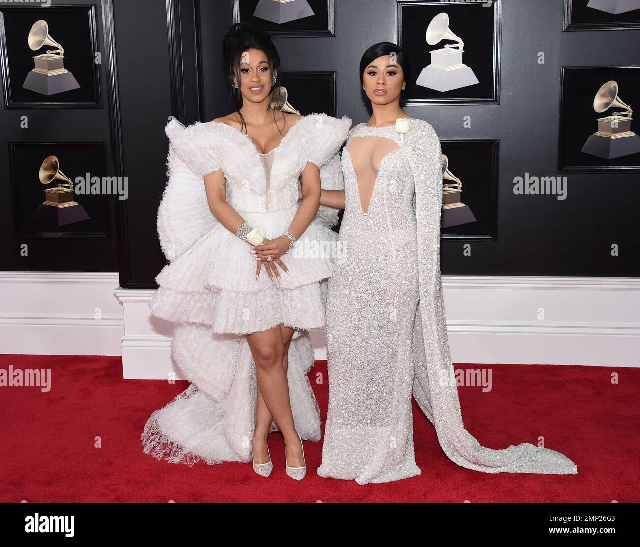 Cardi B, left, and sister Hennessy Carolina arrive at the 60th annual