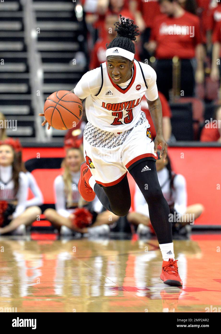 Louisville guard Jazmine Jones (23) brings the ball up court during the