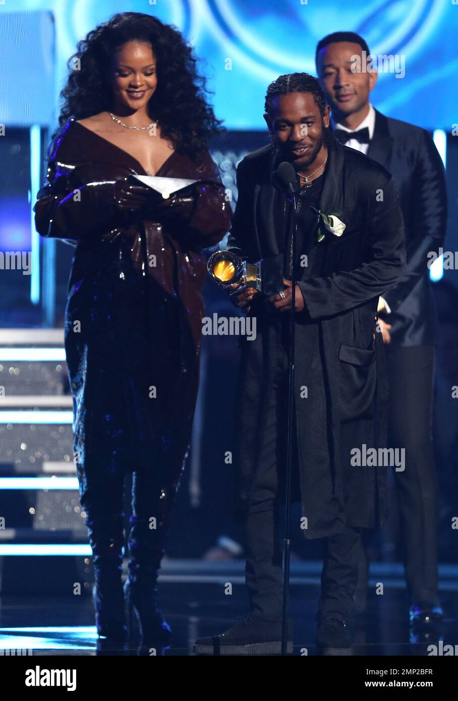 Rihanna, left, and Kendrick Lamar accept the award for best rap/sung