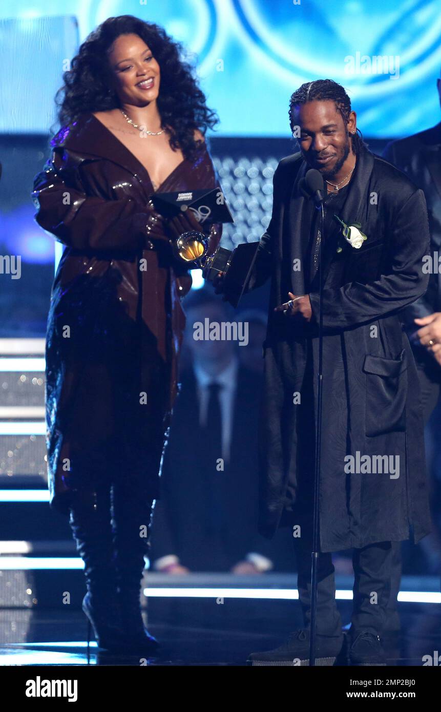 Rihanna, left, and Kendrick Lamar accept the award for best rap/sung  performance for "Loyalty." at the 60th annual Grammy Awards at Madison  Square Garden on Sunday, Jan. 28, 2018, in New York. (