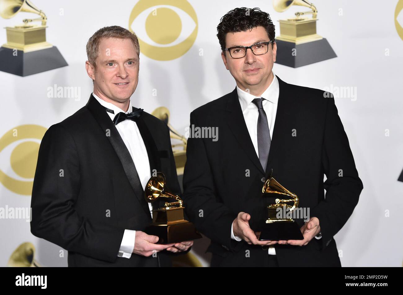John Hanes, left, and Serban Ghenea pose in the press room with the