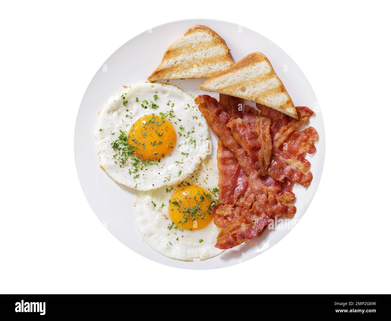 plate of fried eggs, bacon and toast isolated on white background, top ...
