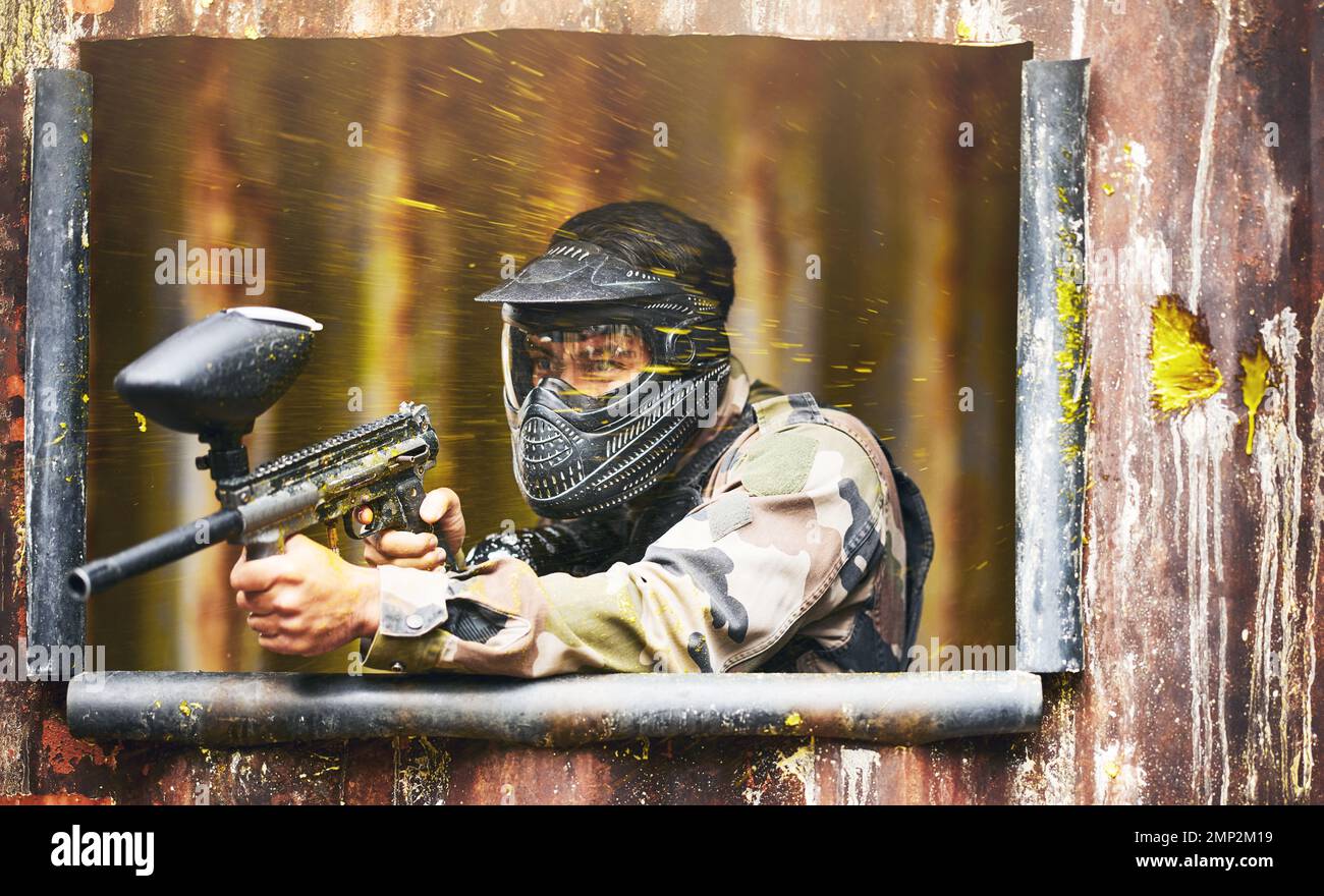 Paintball, gun and camouflage with a sports man playing a military game