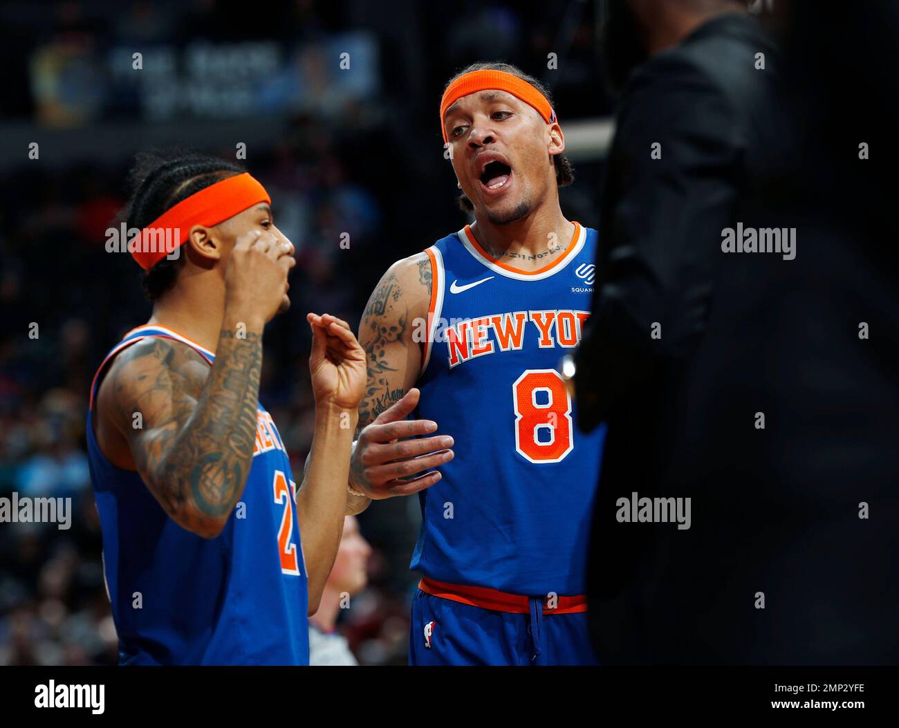 New York Knicks guard Trey Burke (23) confers with New York Knicks forward  Michael Beasley (8)