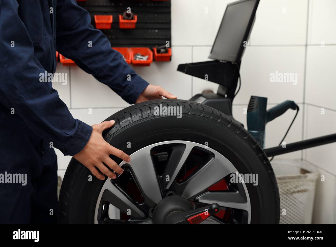 Master balancing car wheel hi-res stock photography and images - Alamy