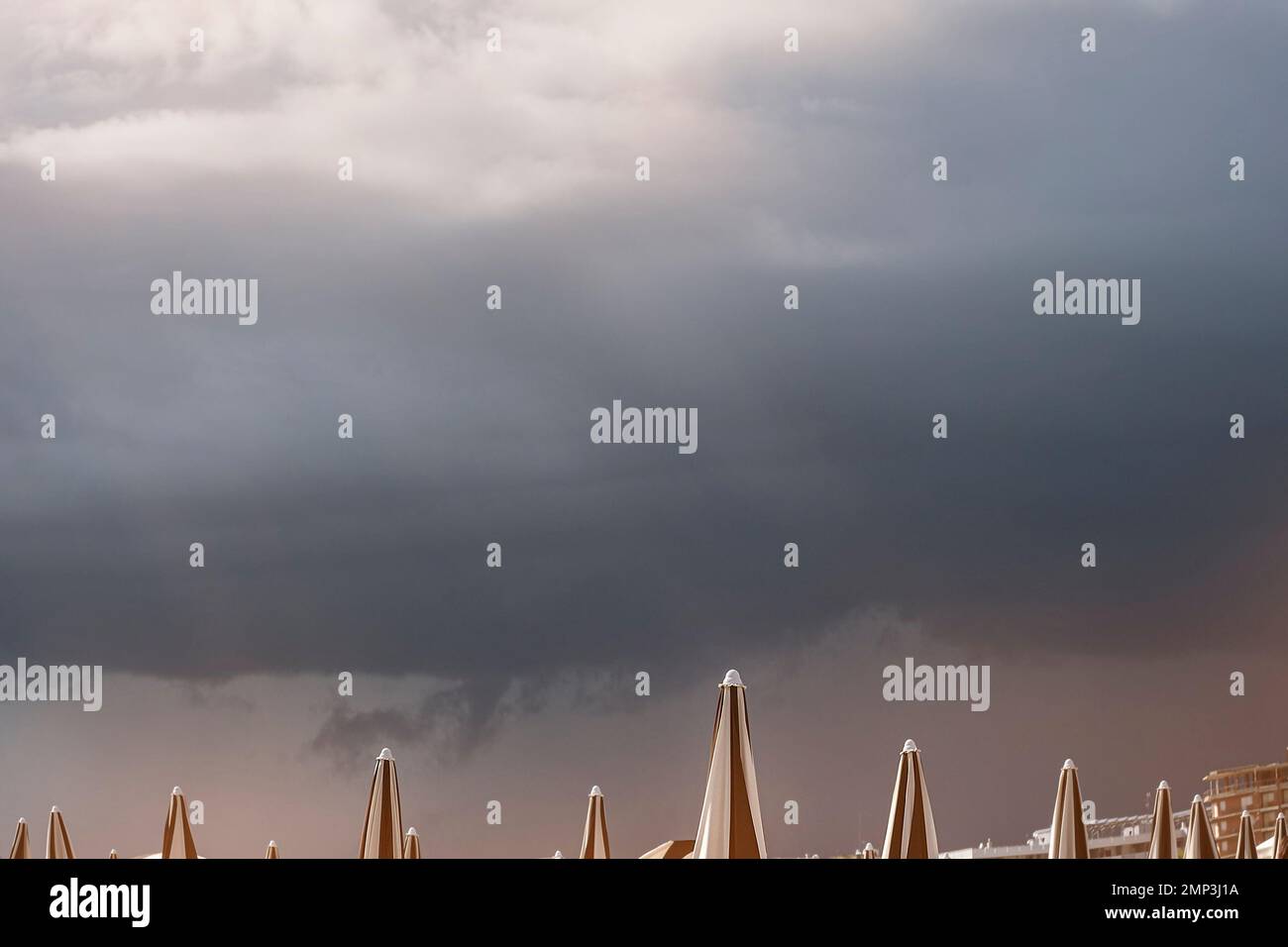 Dramatic dark raining cloud background with Umbrella Stock Photo - Alamy