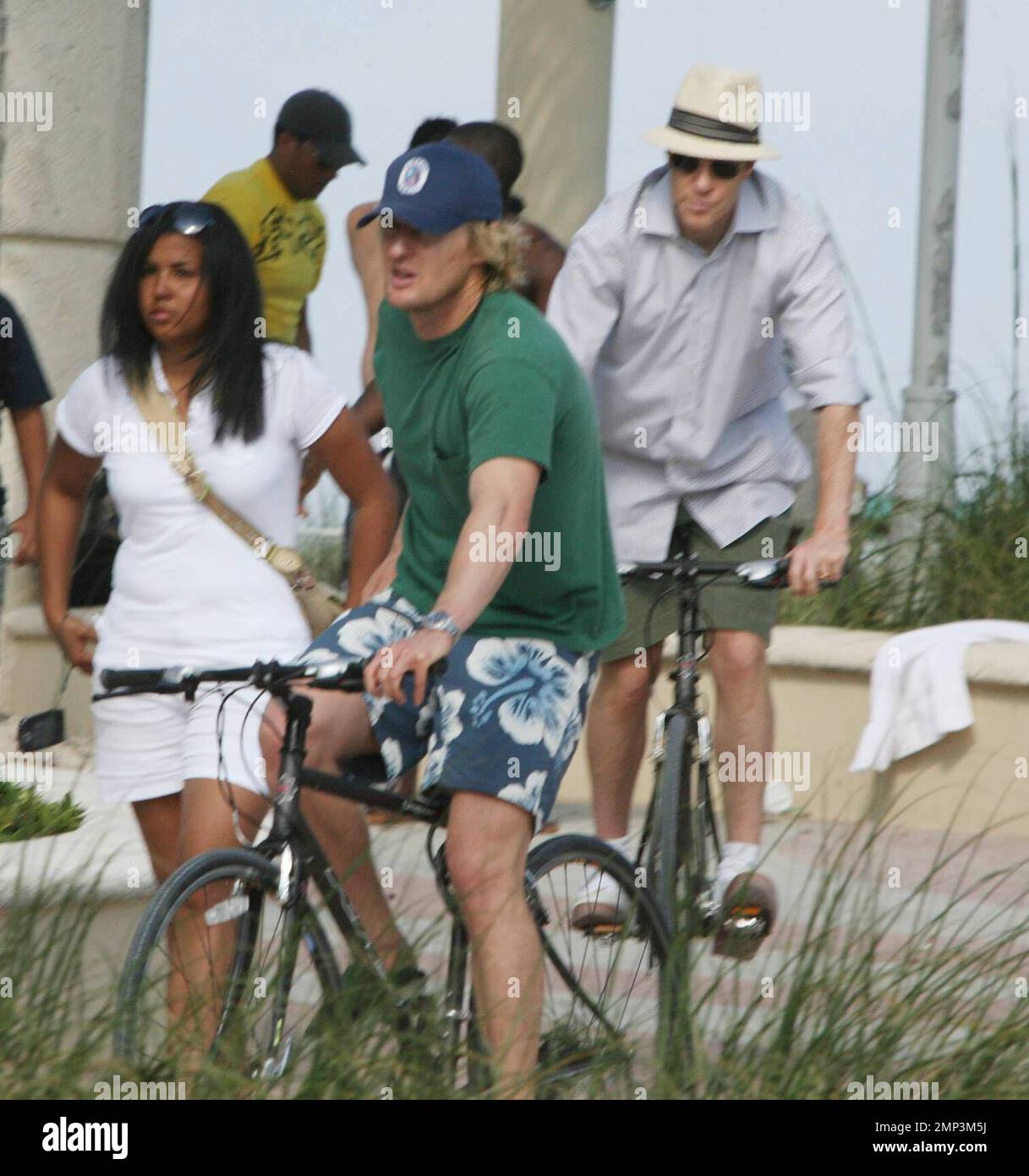 Exclusive!!  Owen Wilson and Vince Vaughn take a Sunday afternoon bike ride along the Miami Beach boardwalk.  The Wedding Crashers buddies also stopped at the Miami Beach Polo World Cup where they chatted to a few ladies in the crowd.  Miami, FL 4/27/08 Stock Photo