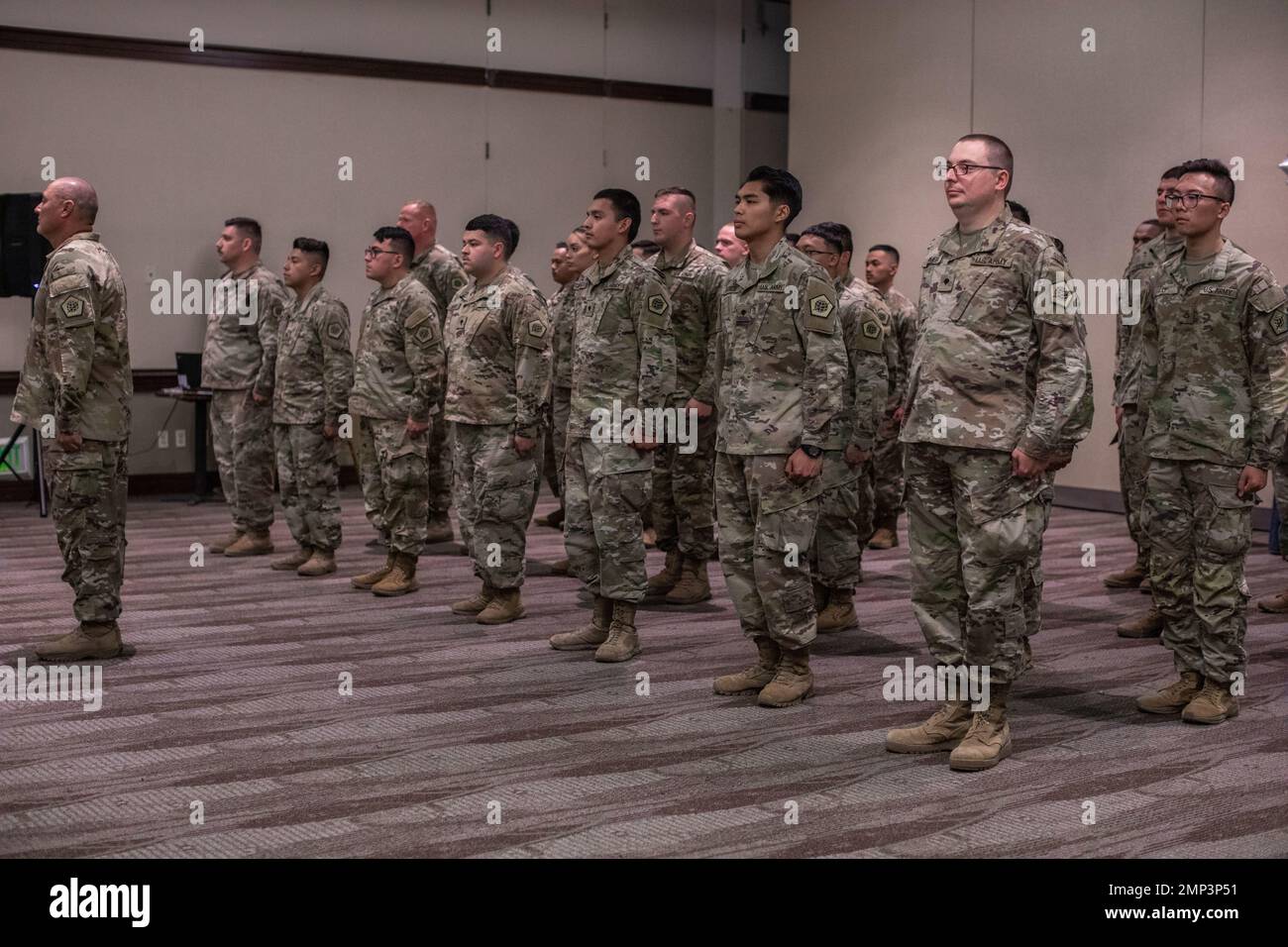 Soldiers assigned to the 812th Signal Company TINE, stand in formation