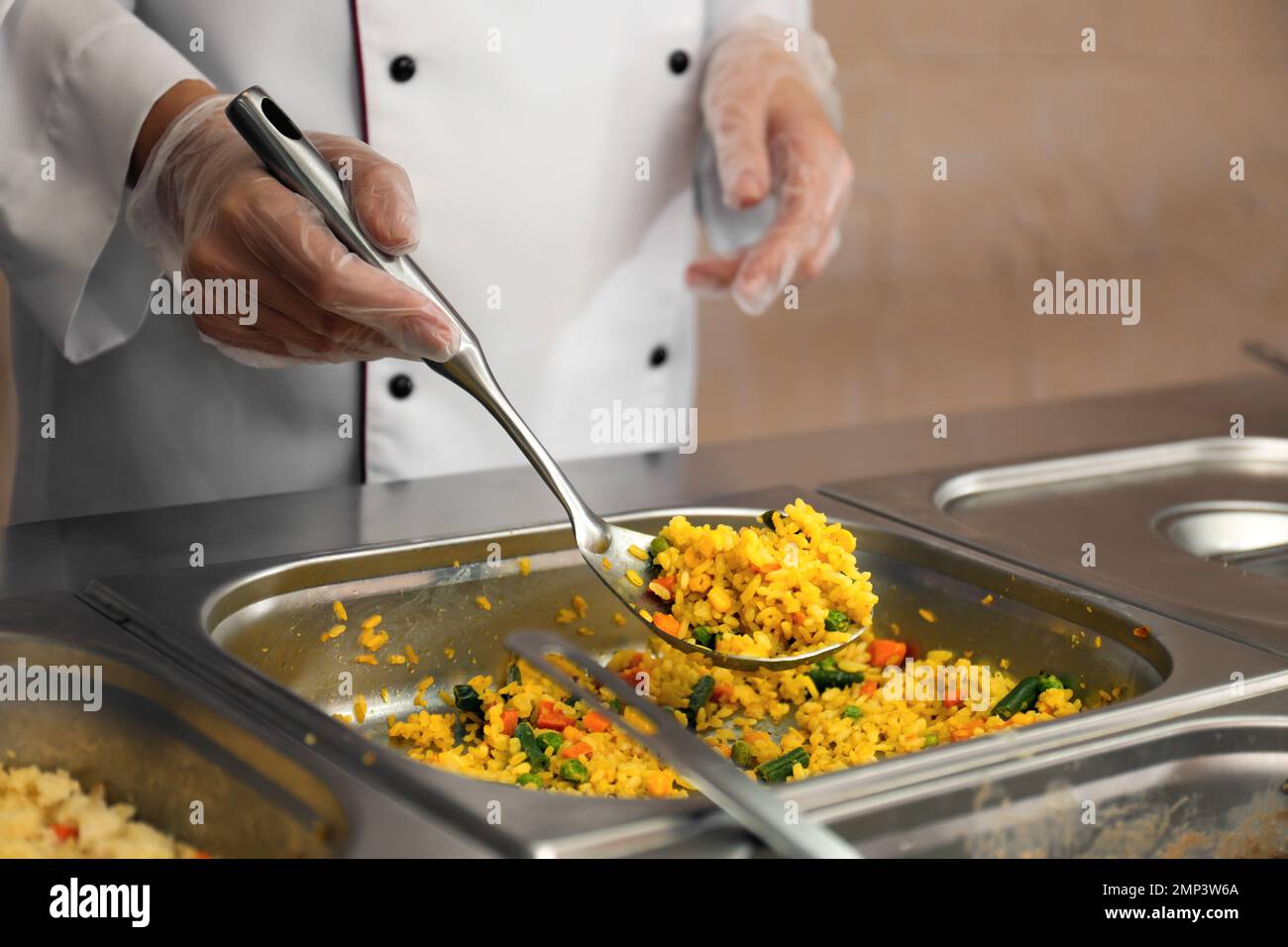School canteen worker at serving line, closeup. Tasty food Stock Photo Alamy