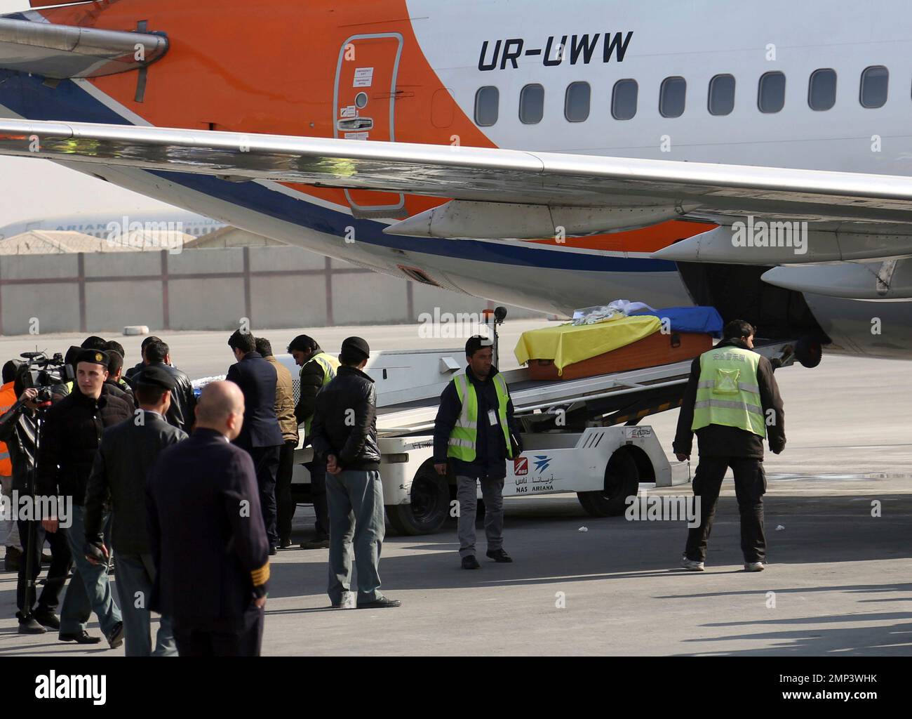 The coffin of a Ukrainian employee of the Kam Air Afghan airline is loaded  into a plane at the international airport in Kabul, Afghanistan, Wednesday,  Jan. 24, 2108. The siege at Kabul's