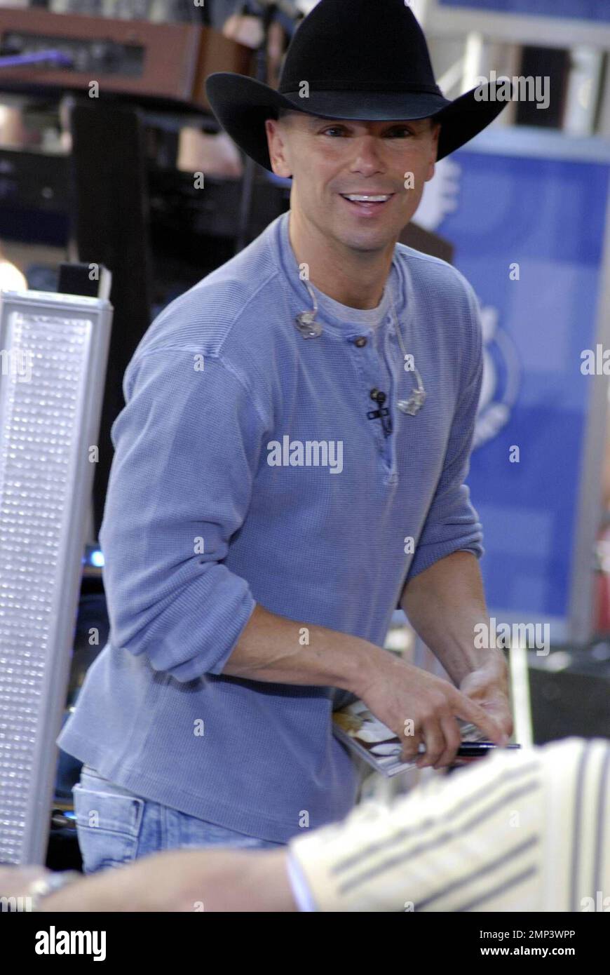 Kenny Chesney signs autographs for fans at his performance on the 'Today Show' concert series in New York, NY. 6/13/08. Stock Photo